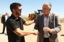 CEO of Switch Rob Roy, left, shakes hands with Nevada Gov. Steve Sisolak during the groundbreak ...