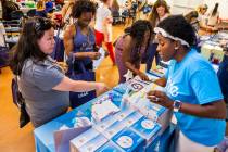 Kathy Mead-Torres (left) learns about the Kiinde Breastfeeding Kit from Aisha Fanning (right) a ...