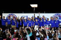Twenty-one of the Democrats seeking the party's presidential nomination pose together after Hou ...