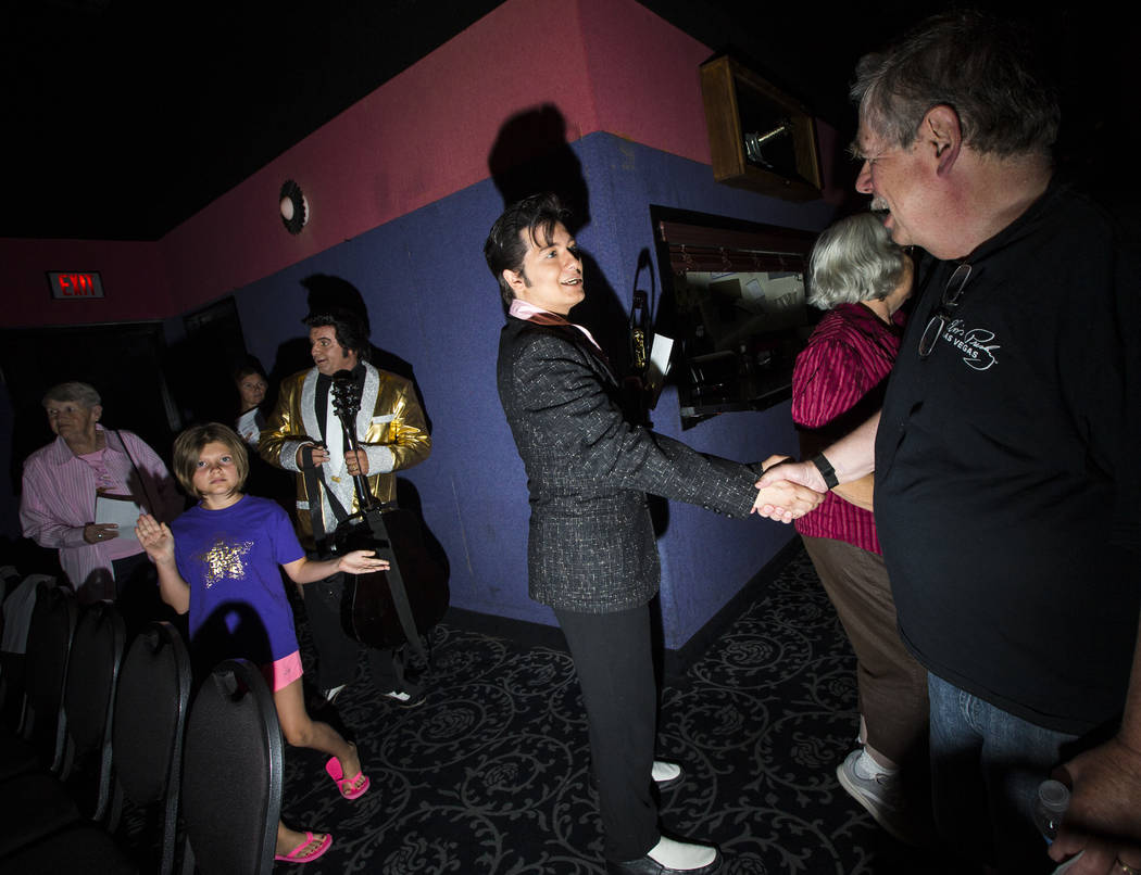 Elvis tribute artist Matthew Boyce, of Saratoga Springs, N.Y., greets fans after winning first ...