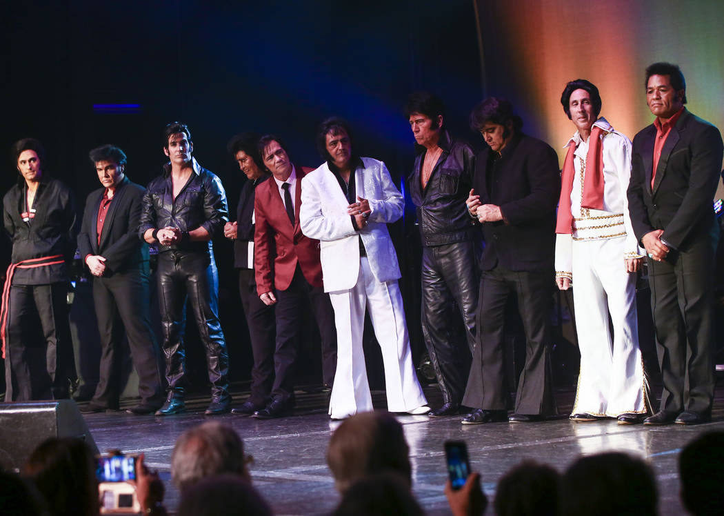 Elvis tribute artists listen as competition results are revealed from the '60s era contest in t ...