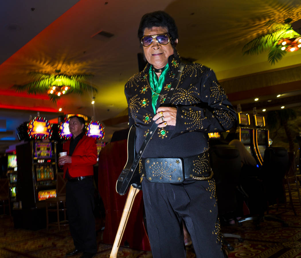 Elvis tribute artist Bob "E" Castro poses for a portrait before performing in the '70 ...