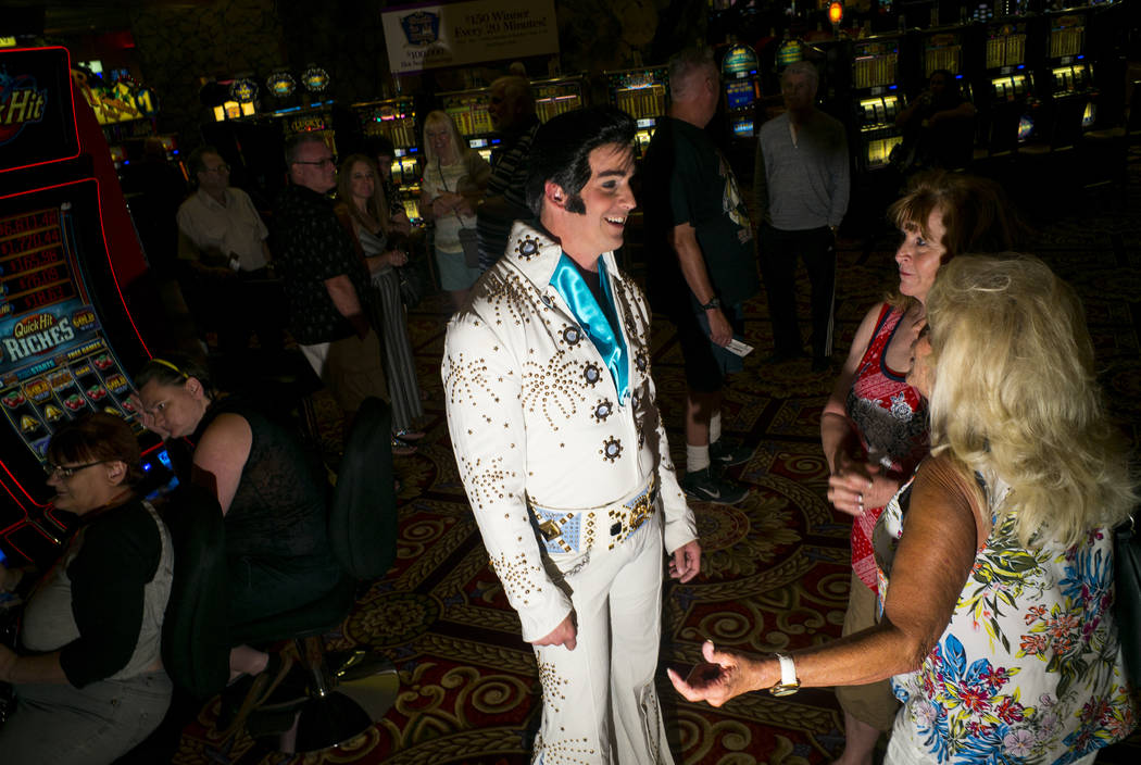 Elvis tribute artist Rob Ely, of Oakdale, Calif., talks with attendees before the start of the ...