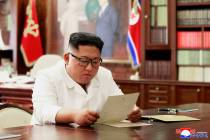 INorth Korean leader Kim Jong Un reads a letter from President Donald Trump. Independent journa ...