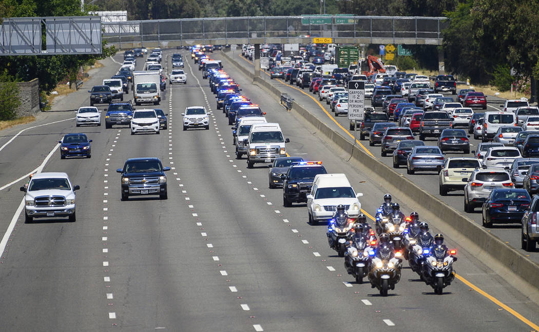 A funeral is led by an honor procession for Sacramento police officer Tara O'Sullivan as they d ...