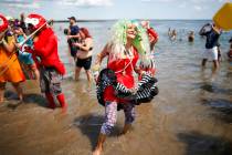Parade attendees in costume make their way along Surf Avenue during the 37th annual Mermaid Par ...