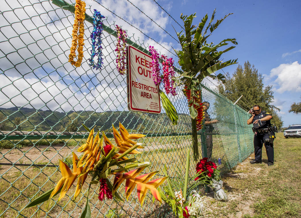 A memorial is seen at the site where a Beechcraft King Air twin-engine plane crashed Friday eve ...