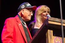 Actress Loni Anderson receives the Millie Taylor award from Lt. Col. Bob Friend, the oldest liv ...