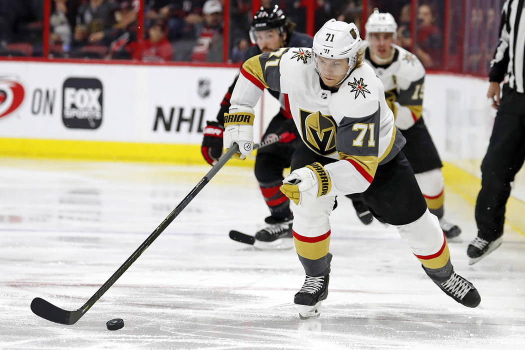 Vegas Golden Knights' William Karlsson (71) brings the puck up the ice against the Carolina Hur ...