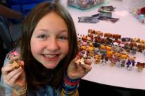 Lila Turner, 11, of Austin, Texas shows her Littlest Pet Shop collection during LPSCon West Coa ...