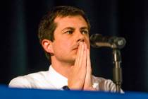 Democratic presidential candidate and South Bend Mayor Pete Buttigieg looks on during a town ha ...