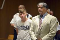 Volodymyr Zhukovskyy of West Springfield stands with his attorney, Donald Frank, during his arr ...