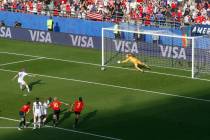 United States' Megan Rapinoe, left, scores her side's second goal from the penalty spot during ...