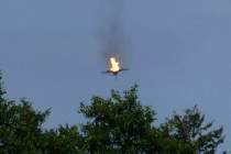 A burning Eurofighter airplane crashes down near the village Malchow in norther Germany, Monday ...