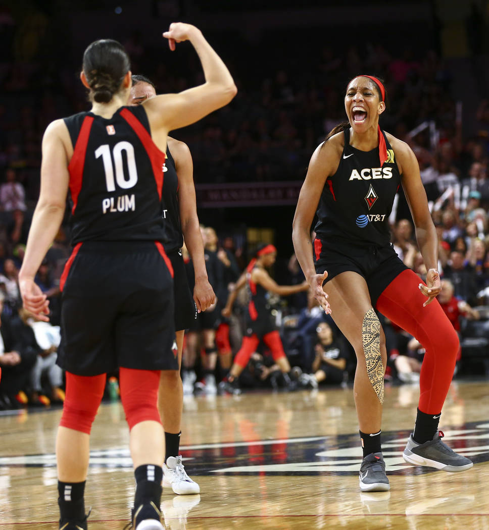 Las Vegas Aces center A'ja Wilson (22) reacts after drawing a foul and scoring against the Wash ...