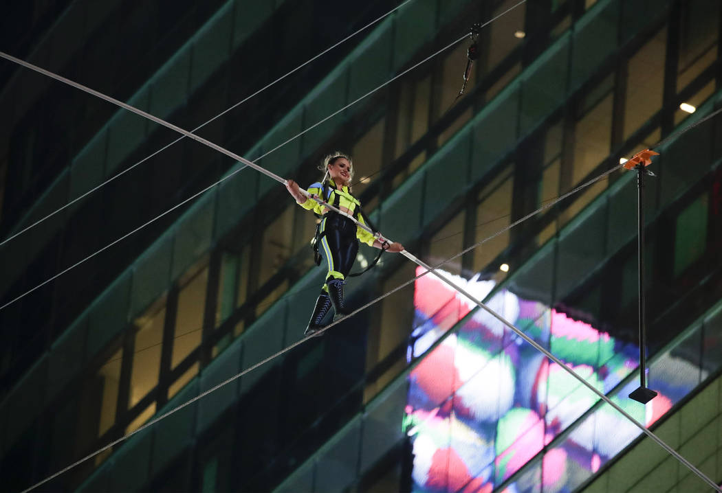 Aerialist Lijana Wallenda walks on a high wire above Times Square, Sunday, June 23, 2019, in Ne ...