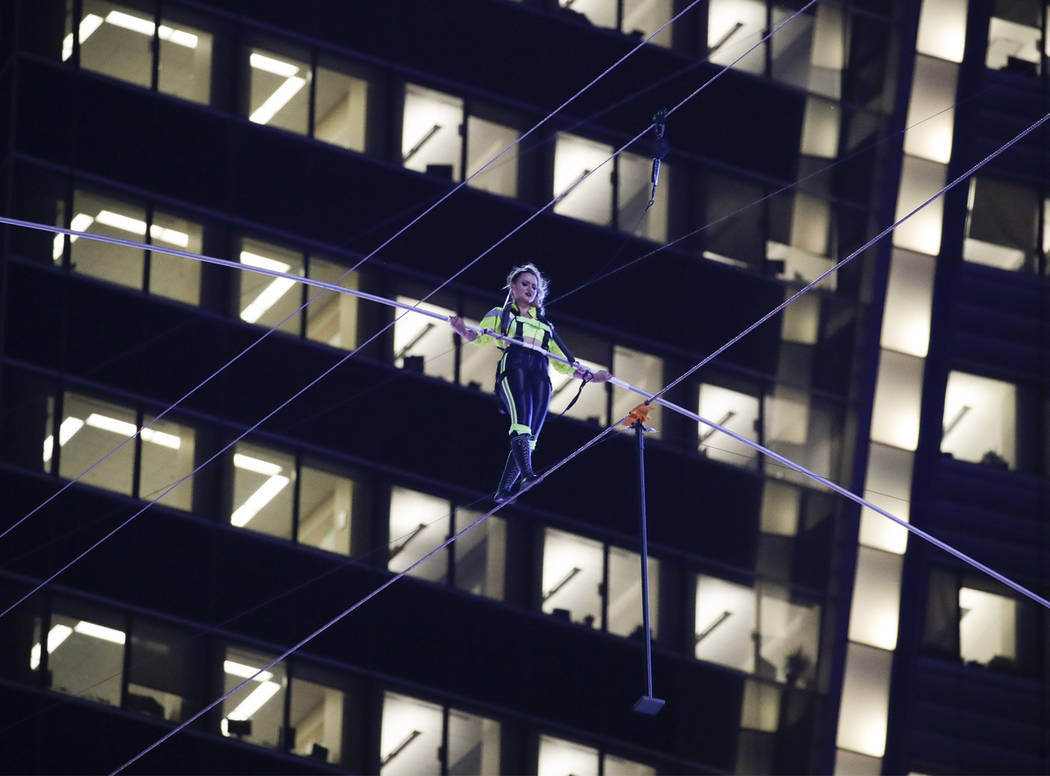 Aerialist Lijana Wallenda walks on a high wire above Times Square, Sunday, June 23, 2019, in Ne ...