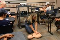 Leslie Shaffer shows attendees at the Heart Health and Hands Only CPR class at the Summerlin Li ...