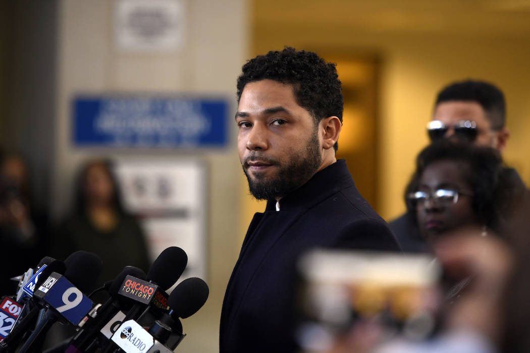 Actor Jussie Smollett talks to the media before leaving Cook County Court after his charges wer ...