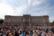 FILE - In this Saturday, June 9, 2018 file photo, Red Arrows fly over Buckingham Palace to atte ...