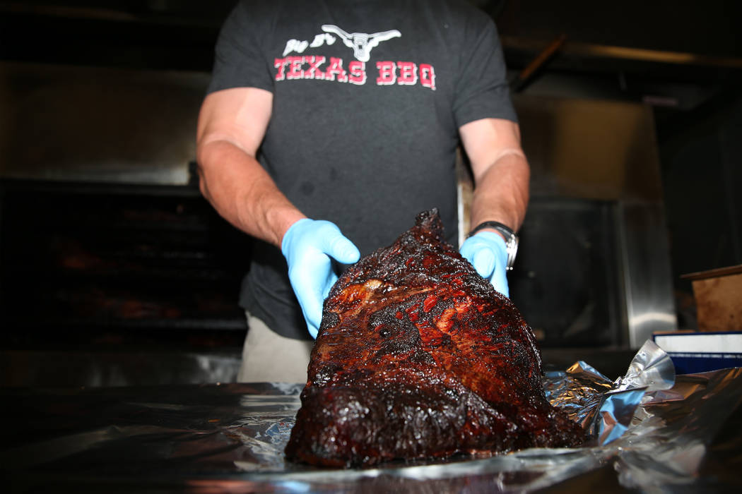 Brian Buechner, owner of Big B's Texas BBQ in Henderson, shows a brisket, Saturday, June 22, 20 ...