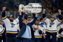 St. Louis Blues head coach Craig Berube carries the Stanley Cup after the Blues defeated the Bo ...