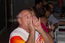 James Larocca, 69, boos while watching a Democratic primary debate during a watch party held by ...