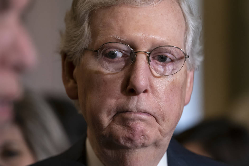 Senate Majority Leader Mitch McConnell, R-Ky., pauses before speaking to reporters following th ...