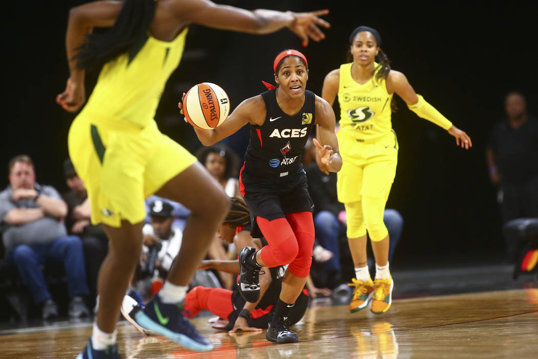Las Vegas Aces guard Sydney Colson (51) brings the ball up court against the Seattle Storm duri ...