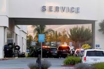 Police investigate at the scene of a shooting at the Morgan Hill Ford Store in Morgan Hill, Cal ...
