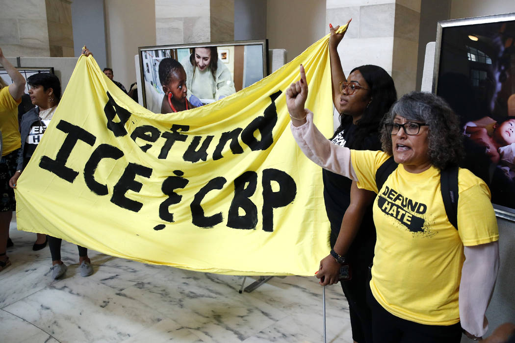 Protesters gather to demand the defunding of government agencies for border protection and cust ...