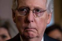 Senate Majority Leader Mitch McConnell, R-Ky., pauses before speaking to reporters at the Capit ...