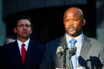 FILE - In this Jan. 11, 2019 file photo, acting Broward County sheriff Gregory Tony, right, spe ...