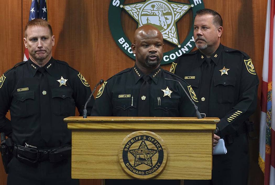 Broward Sheriff Gregory Tony, center, announces that two additional deputies have been fired as ...