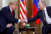 In a July 16, 2018, file photo, U.S. President Donald Trump, left, and Russian President Vladim ...