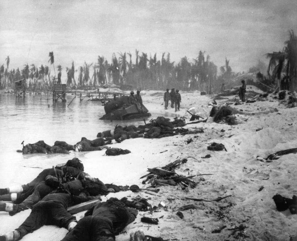 FILE - In this Nov. 1943 file photo, sprawled bodies are seen on the beach of Tarawa atoll test ...