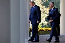 FILE - In this Nov. 2, 2017, file photo President Donald Trump walks with Federal Reserve board ...