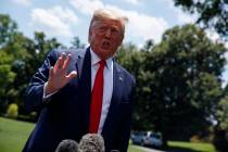 President Donald Trump talks with reporters before departing to Japan for the G20 summit, Wedne ...