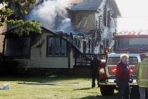 Responders work the scene of a deadly house fire in Pickerel, Wis., Tuesday, June 25, 2019. Aut ...