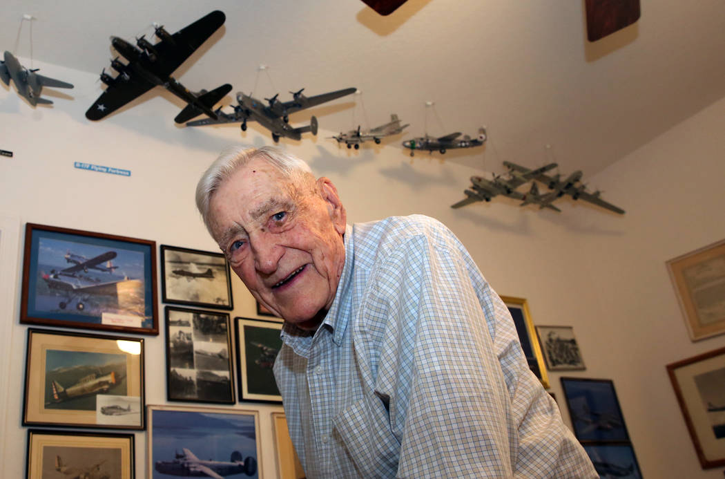 U. S. Army Air Corps and the U.S. Air Force pilot James Parker, 97, poses for a photo at his La ...
