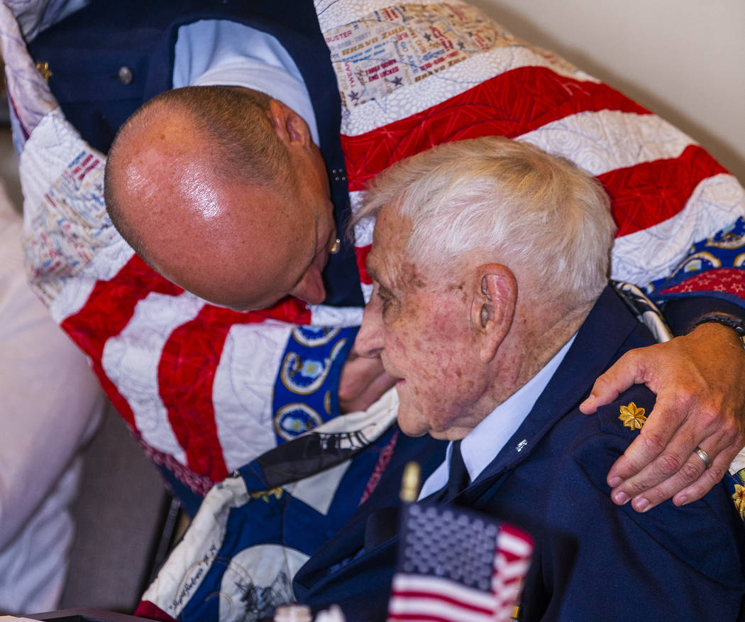 Retired Air Force Maj. Trent Arnold hugs his grandfather James "Jim" A. Parker as Th ...