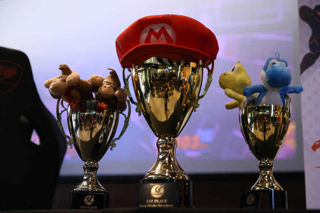 Winner trophies on display during the Super Smash Bros. Ultimate Showdown tournament at GameWor ...