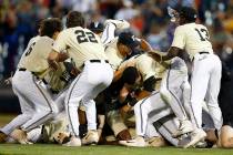 Vanderbilt players celebrate after defeating Michigan in Game 3 of the NCAA College World Serie ...
