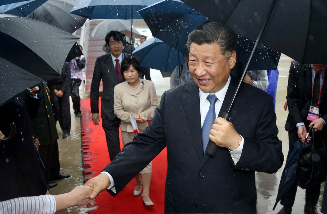 China's President Xi Jinping arrives at Kansai International Airport in Izumisano, Osaka prefec ...