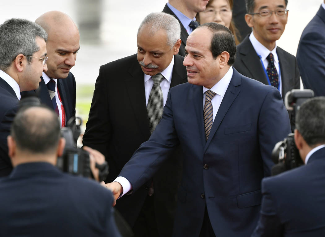Egyptian President Abdel Fattah el-Sisi, center, arrives at Kansai International Airport in Izu ...