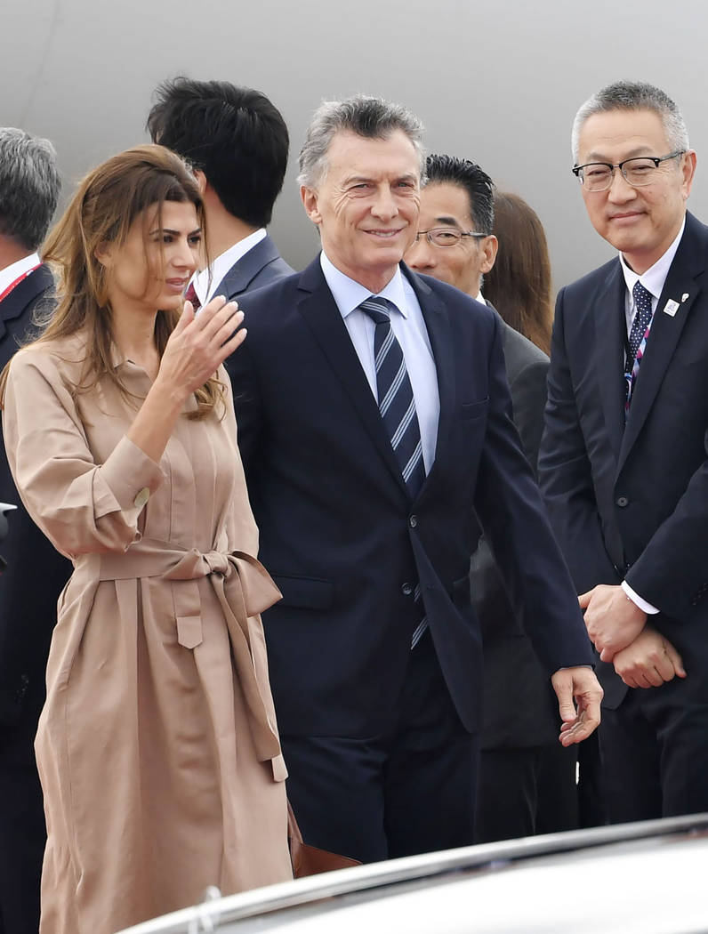 Argentina's President Mauricio Macri, center right, and his wife first lady Juliana Awada arriv ...