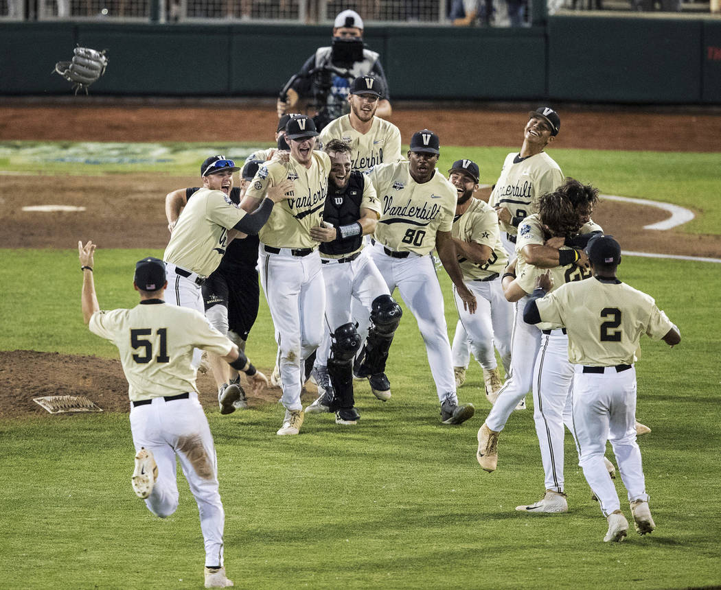 Vanderbilt celebrates an 8-2 win over Michigan during the deciding game of the NCAA College Wor ...