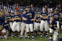 Michigan players including Jeff Criswell (17) watch as Vanderbilt celebrates after Vanderbilt d ...