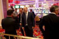 Wynn Resorts CEO Matt Maddox right, visits with Randy Greenstein, left, and Ed Kane, owners of ...
