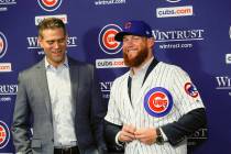 In this June 7, 2019, file photo, Chicago Cubs President Theo Epstein, left, introduces pitcher ...